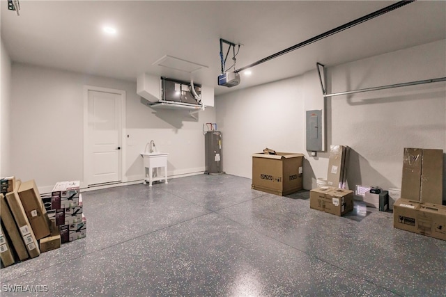 garage featuring water heater, electric panel, and a garage door opener