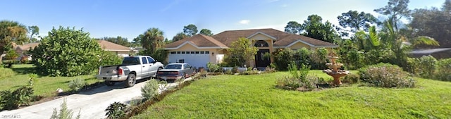 view of front facade with a front yard and a garage