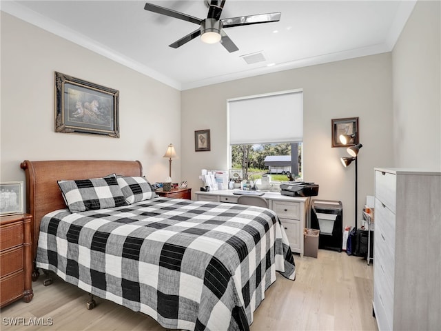 bedroom with ceiling fan, light hardwood / wood-style flooring, and ornamental molding