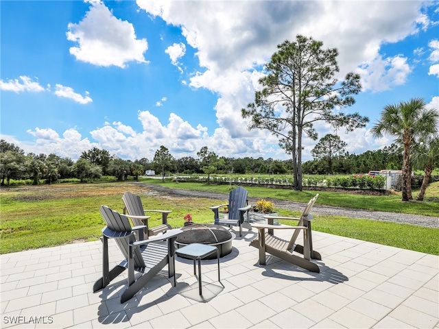 view of patio featuring an outdoor fire pit