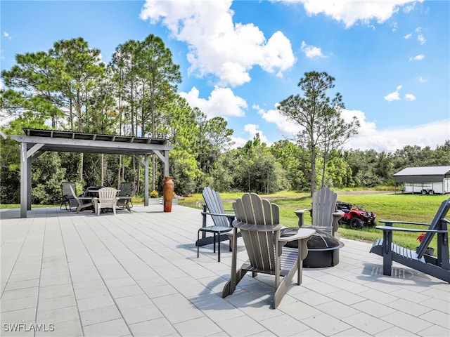 view of patio featuring a fire pit