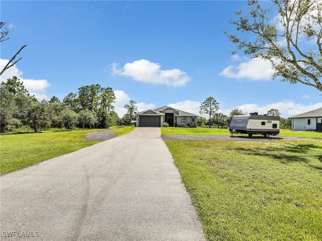 view of front facade featuring a front lawn and a garage