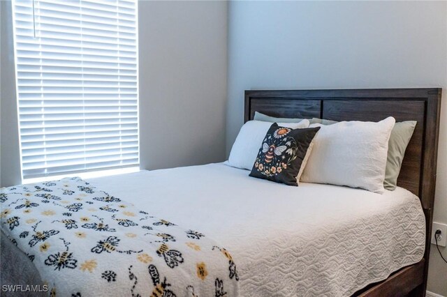 bedroom featuring multiple windows