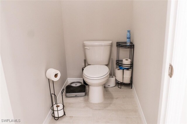 bathroom featuring tile patterned floors and toilet