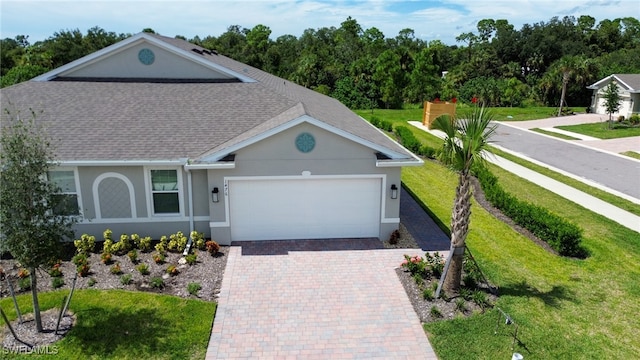 ranch-style house with a front yard and a garage