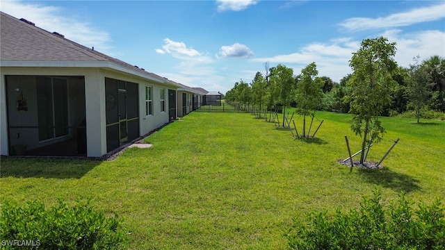 view of yard featuring a sunroom