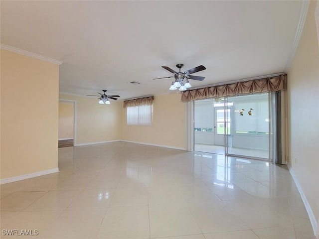 spare room featuring plenty of natural light, ceiling fan, light tile patterned floors, and crown molding