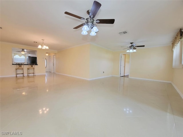 unfurnished living room featuring a notable chandelier, light tile patterned flooring, and ornamental molding