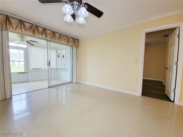 tiled empty room featuring ornamental molding