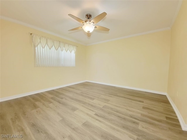 empty room featuring wood-type flooring, ceiling fan, and ornamental molding