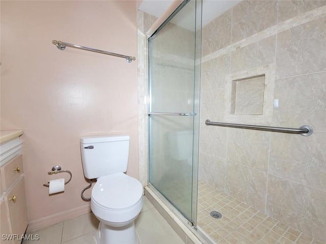 bathroom with toilet, tile patterned flooring, and walk in shower