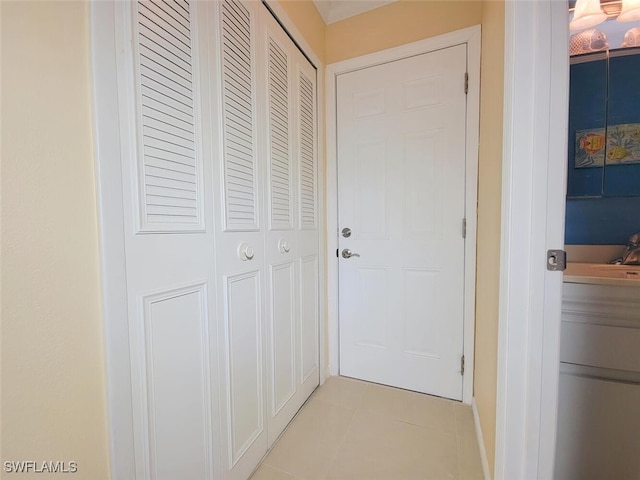 corridor featuring light tile patterned flooring