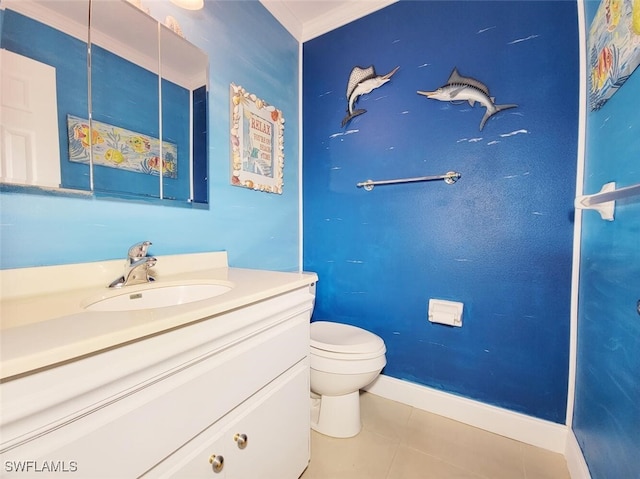 bathroom with tile patterned flooring, vanity, toilet, and ornamental molding