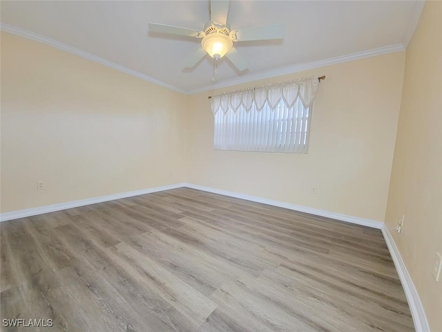 empty room with light wood-type flooring, ceiling fan, and crown molding