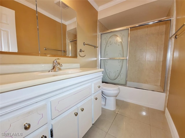 full bathroom featuring vanity, tile patterned floors, toilet, enclosed tub / shower combo, and ornamental molding