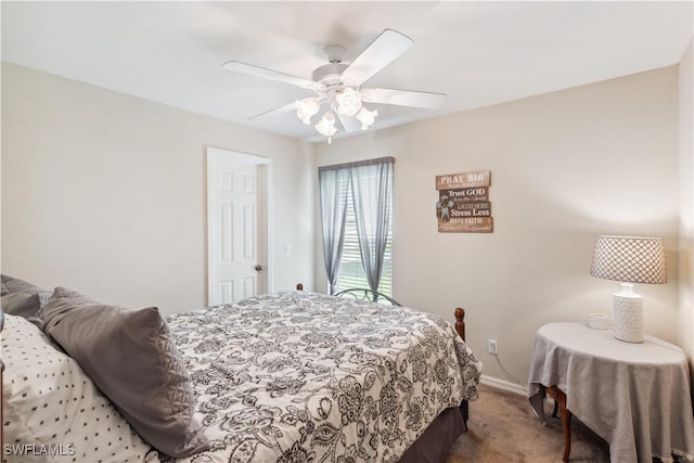 carpeted bedroom featuring ceiling fan and baseboards