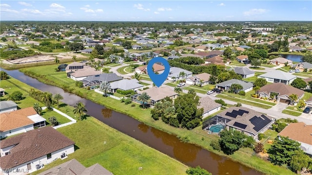 aerial view with a residential view and a water view