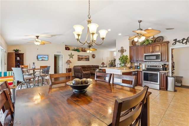dining area featuring light tile patterned floors, recessed lighting, visible vents, and ceiling fan with notable chandelier