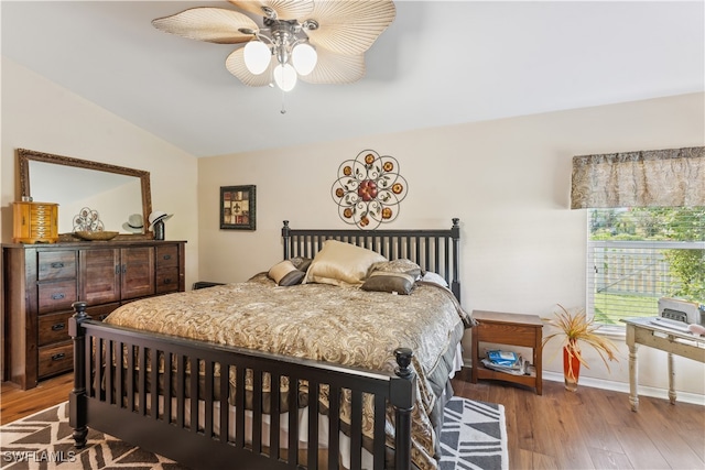 bedroom with wood-type flooring, lofted ceiling, and ceiling fan