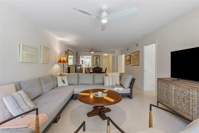 living room featuring ceiling fan