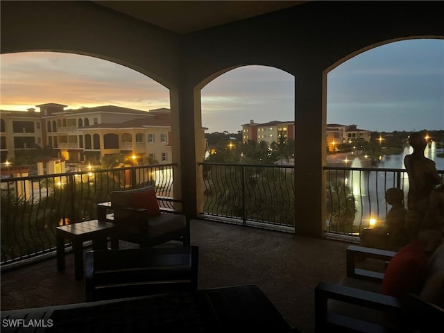 balcony at dusk with a water view