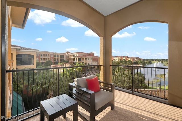 balcony featuring a water view