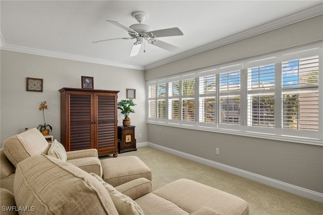 carpeted living room featuring ornamental molding, ceiling fan, and plenty of natural light