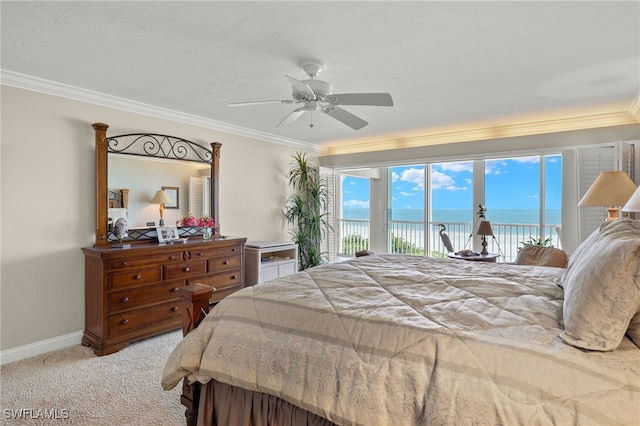 carpeted bedroom featuring ceiling fan, crown molding, access to exterior, and a water view