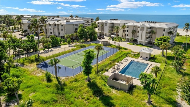 birds eye view of property with a water view