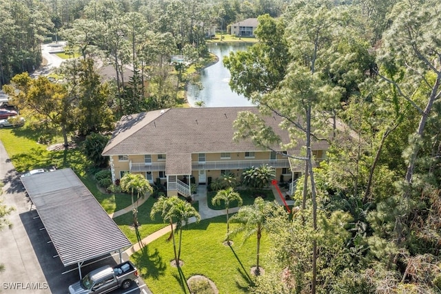 birds eye view of property with a water view