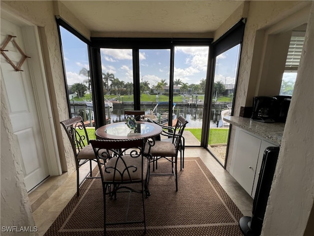 sunroom with a water view