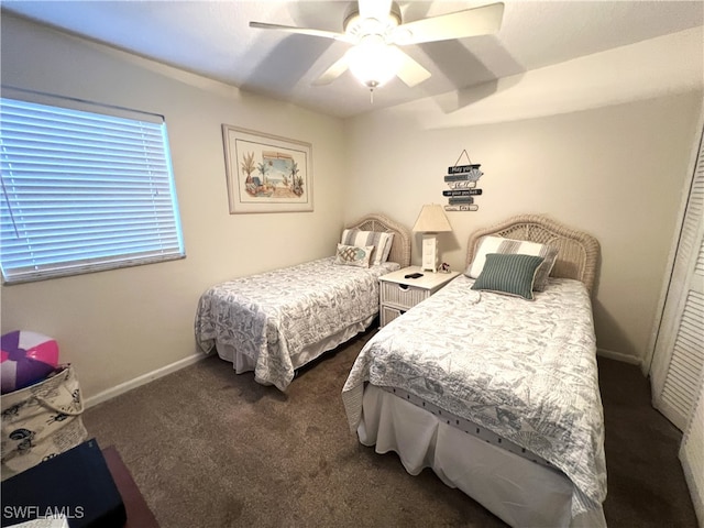 carpeted bedroom with a closet and ceiling fan