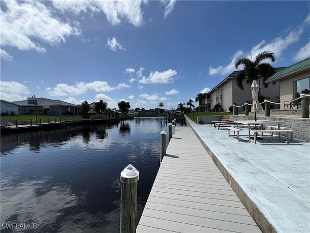 dock area with a water view