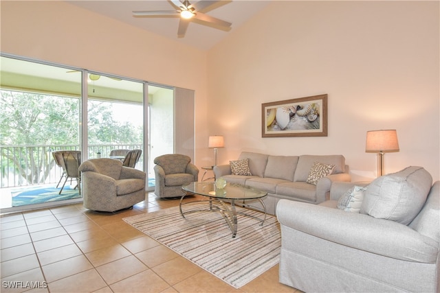 tiled living room with high vaulted ceiling and ceiling fan