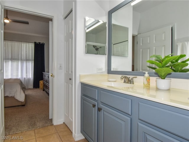 bathroom featuring tile patterned floors, vanity, and ceiling fan