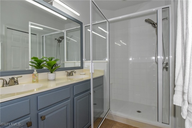 bathroom featuring vanity, tile patterned floors, and an enclosed shower