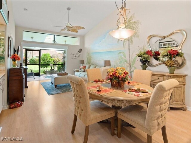 dining space with light hardwood / wood-style floors and ceiling fan