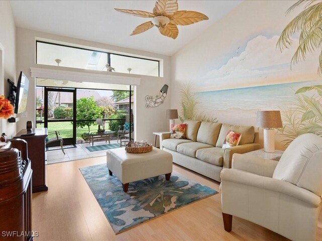 living room featuring light hardwood / wood-style floors and ceiling fan