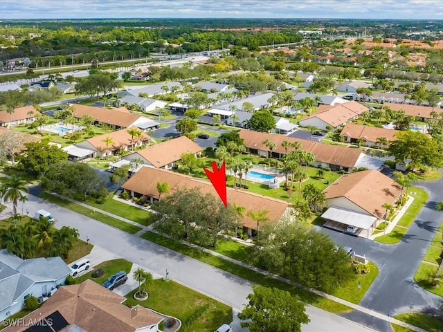 birds eye view of property with a residential view