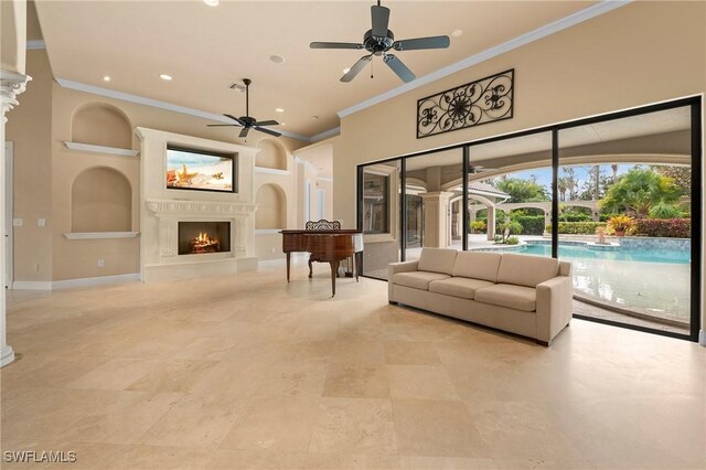 unfurnished living room featuring ceiling fan, crown molding, and built in features