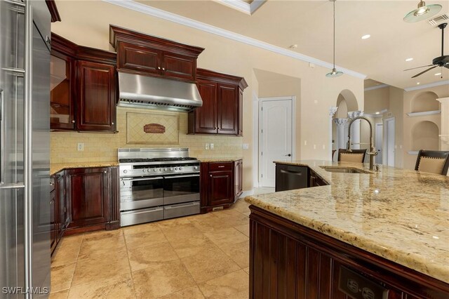 kitchen featuring ceiling fan, light stone counters, ornamental molding, sink, and stainless steel appliances