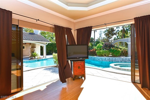 interior space with hardwood / wood-style flooring and crown molding