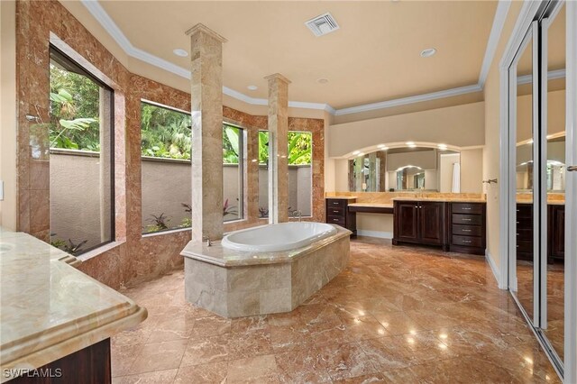 bathroom featuring crown molding, vanity, and a relaxing tiled tub