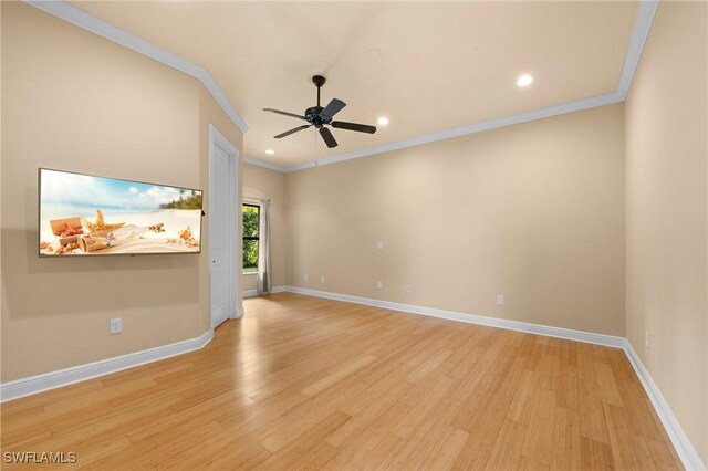 empty room with ceiling fan, light wood-type flooring, and crown molding