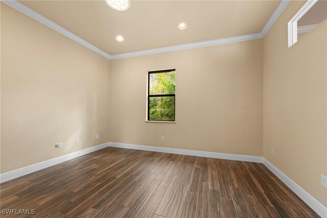 unfurnished room with crown molding and dark hardwood / wood-style flooring