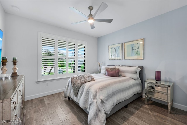 bedroom with ceiling fan and dark wood-type flooring