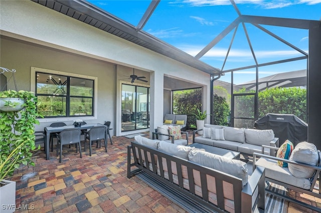 view of patio featuring ceiling fan, a lanai, an outdoor hangout area, and grilling area