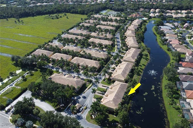 bird's eye view with a water view and a residential view