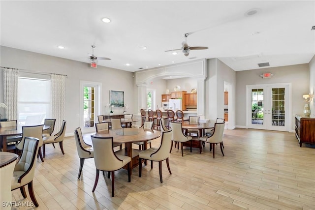 dining area with french doors, decorative columns, recessed lighting, ceiling fan, and light wood-type flooring