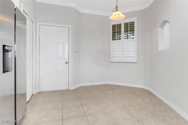 unfurnished room with light tile patterned floors, baseboards, and ornamental molding